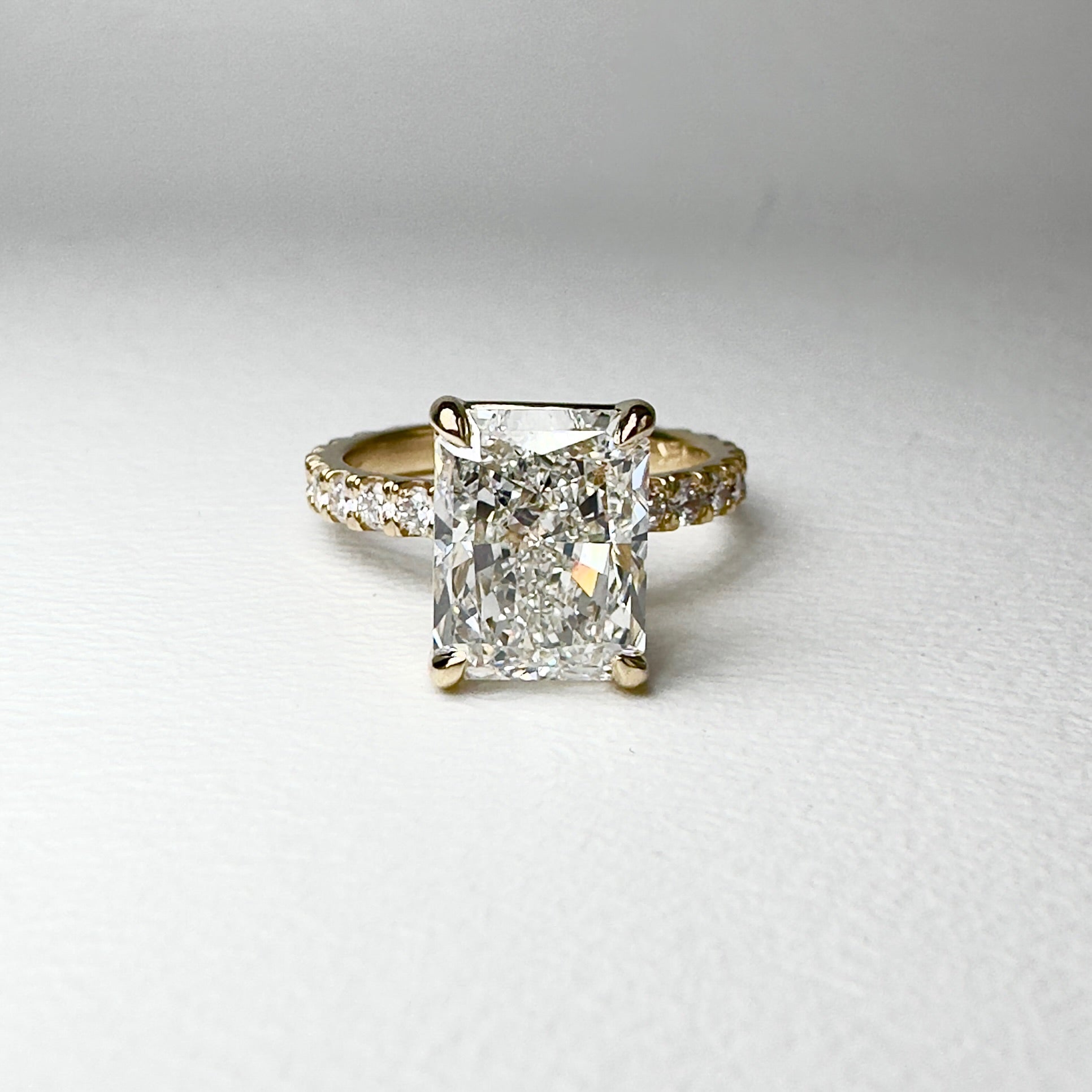 Radiant cut solitaire diamond ring